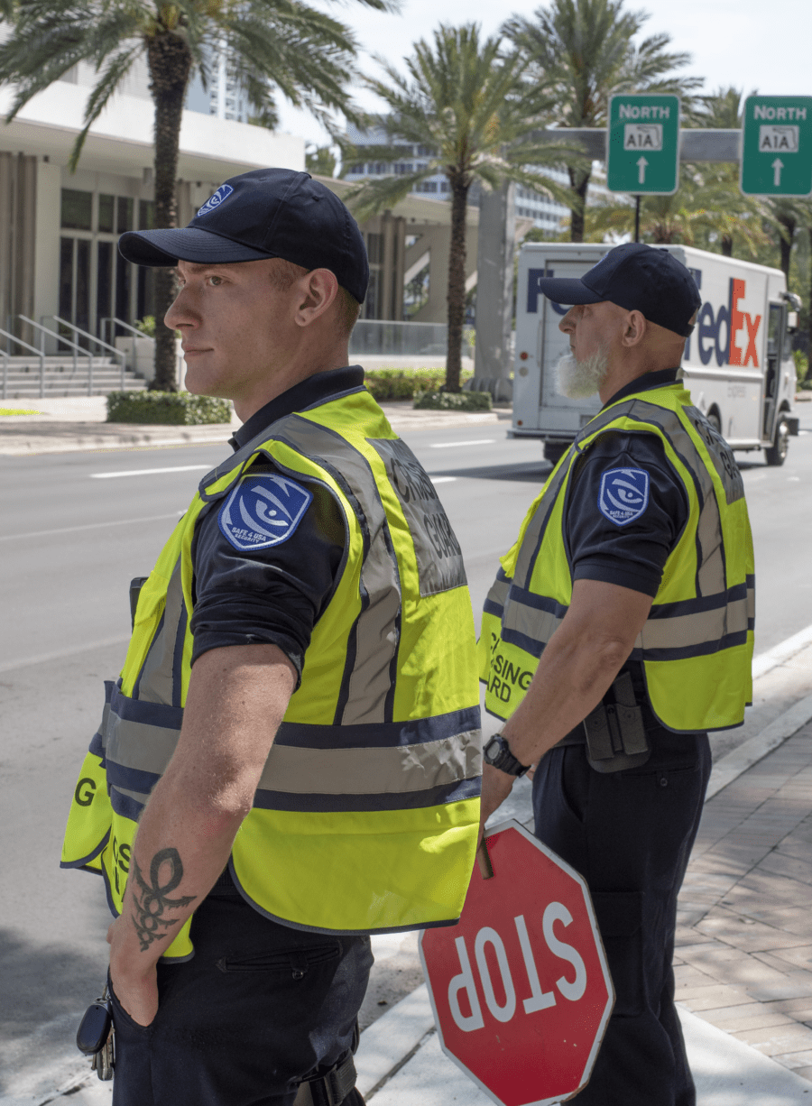Safe 4 USA security guards in hi-vis vests with company patches